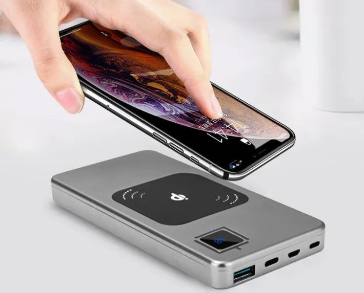 Silver alloy portable power bank with an LCD display showing battery level.