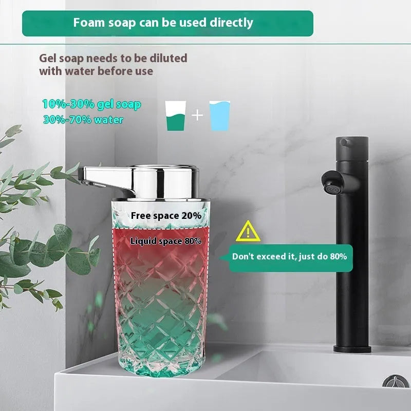 Silver automatic soap dispenser with USB type-C charging port on a bathroom counter.