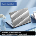 Transparent plastic protective case for a MacBook laptop on a table.