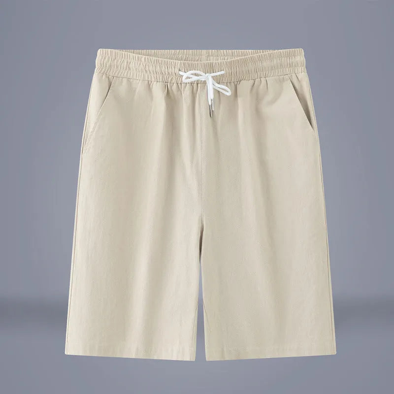 Cotton linen cropped casual pants with drawstring waist in solid Army Green colour on a hanger.