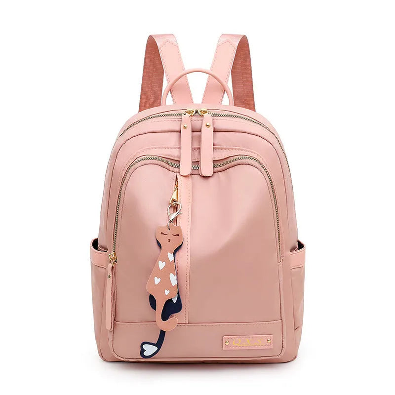 Black and pink views of a women's casual nylon backpack with double straps, a soft handle, and an external pocket.