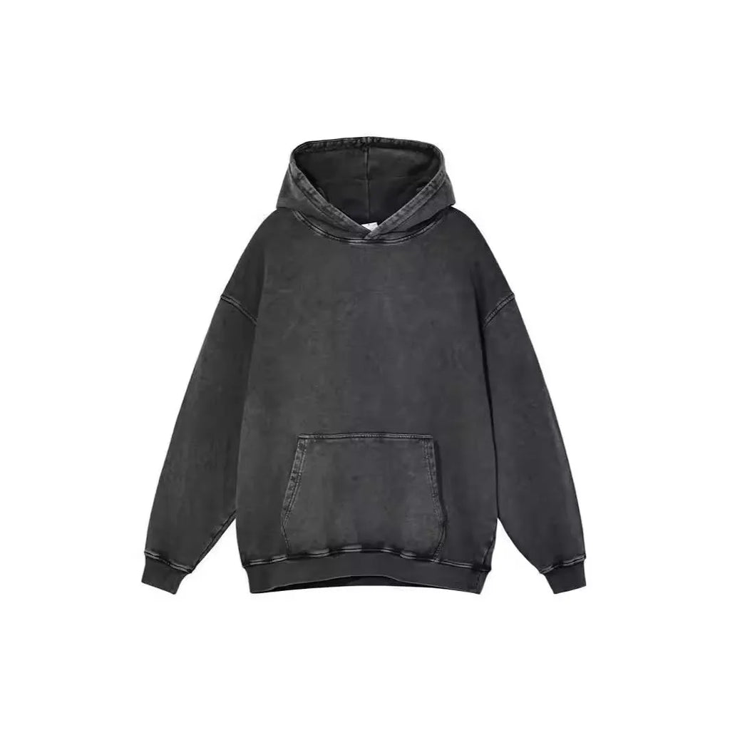 Men's loose-fit collarless hoodie in washed cotton with batik print, showing drop-shoulder sleeves.