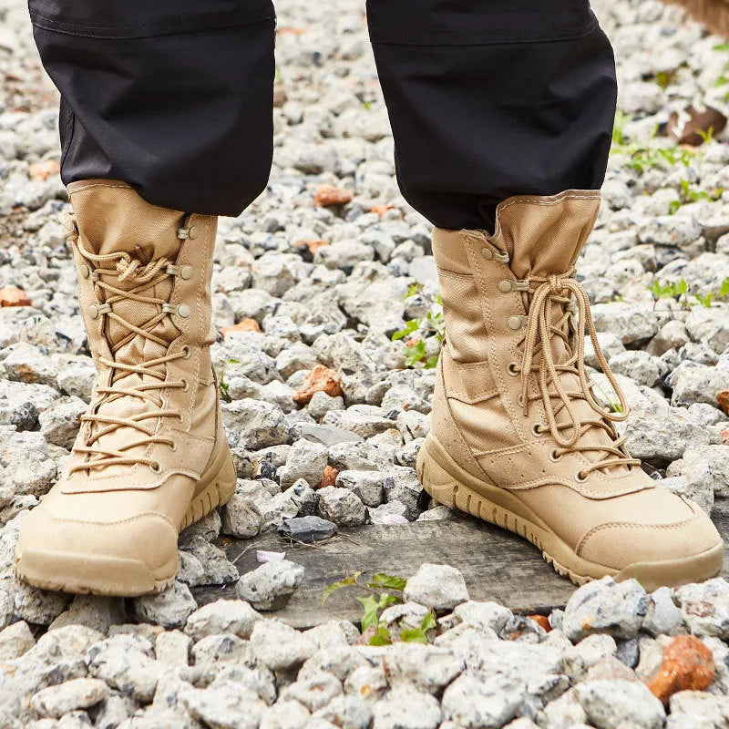 Yulong summer tactical desert combat boots in black or sand colour on an outdoor rocky terrain.
