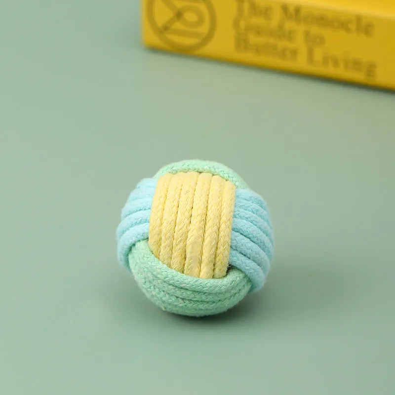 Handmade small blue powder, green blue, and pink green plush cotton ball cat toy for teeth grinding.