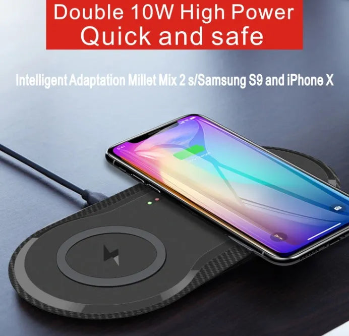 Black and white dual wireless charger showing two phones charging simultaneously on separate pads