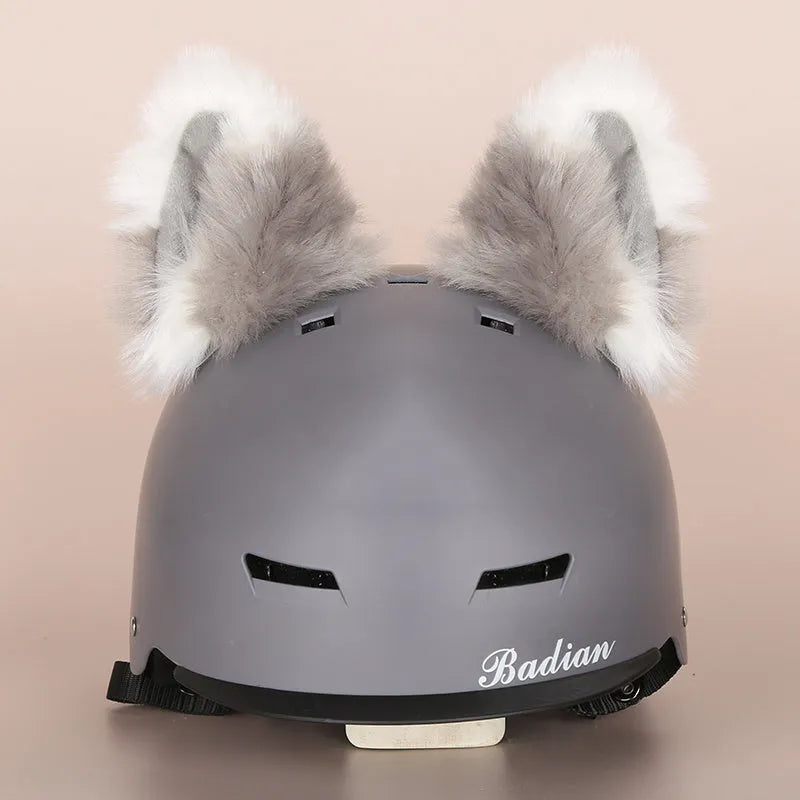 Plush cartoon-themed cover set on a medium motorcycle helmet with soft ear decorations.