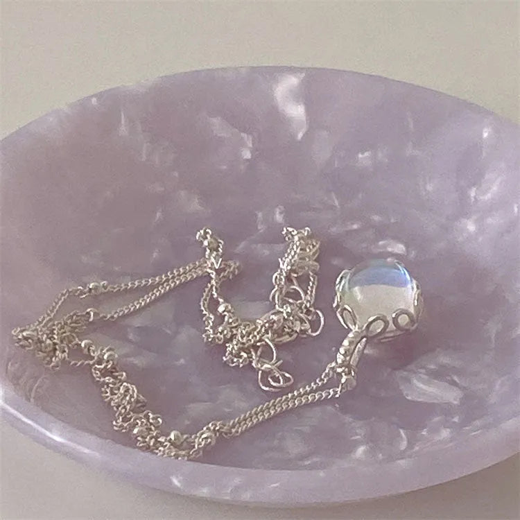 Silver 925 ornamental stone necklace with geometric pendant on a curb chain.