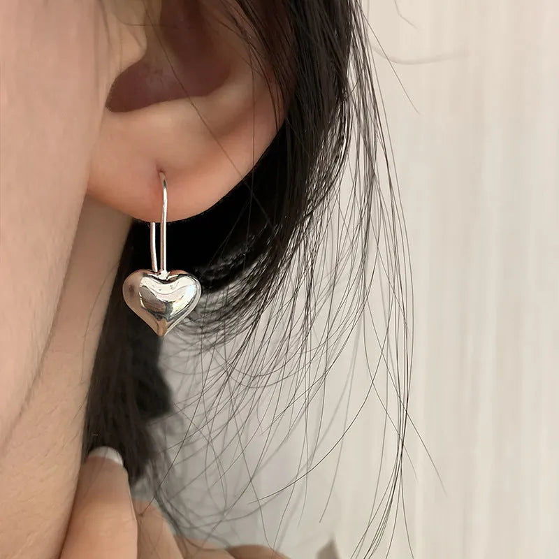 Silver heart-shaped earrings with Korean style design and glossy finish