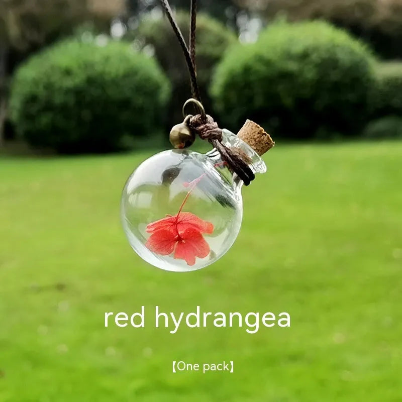 Glass car perfume pendant with preserved flowers in selected colour and diameter