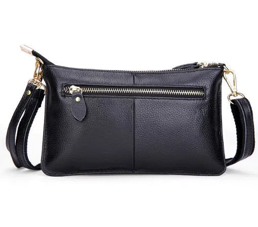 Lady cowhide slant handbag showing front compartment and adjustable shoulder strap in multiple colour options