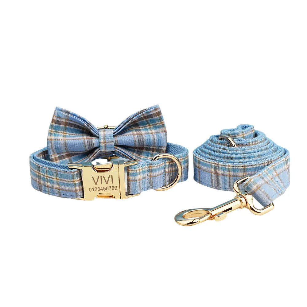 Sky blue grid forest pattern dog collar and leash set with matching vest and decorative bow.