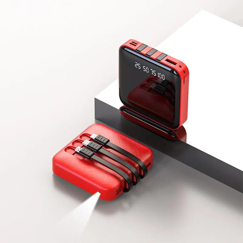 Black or red plastic power bank with an integrated charging cable, showing compact size.
