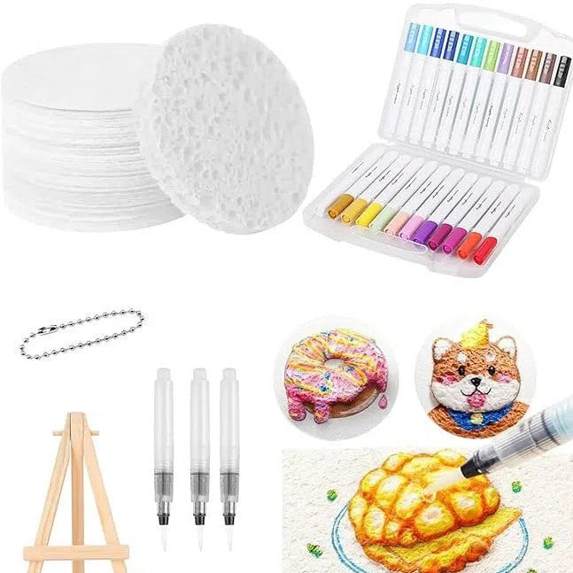 DIY brush set with foam grained paper, 12 marker pens, three fountain pens, beads, chain, and mini easel on a table