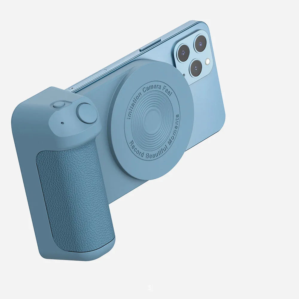 Black magnetic phone camera grip holder with rotatable bracket on a table.