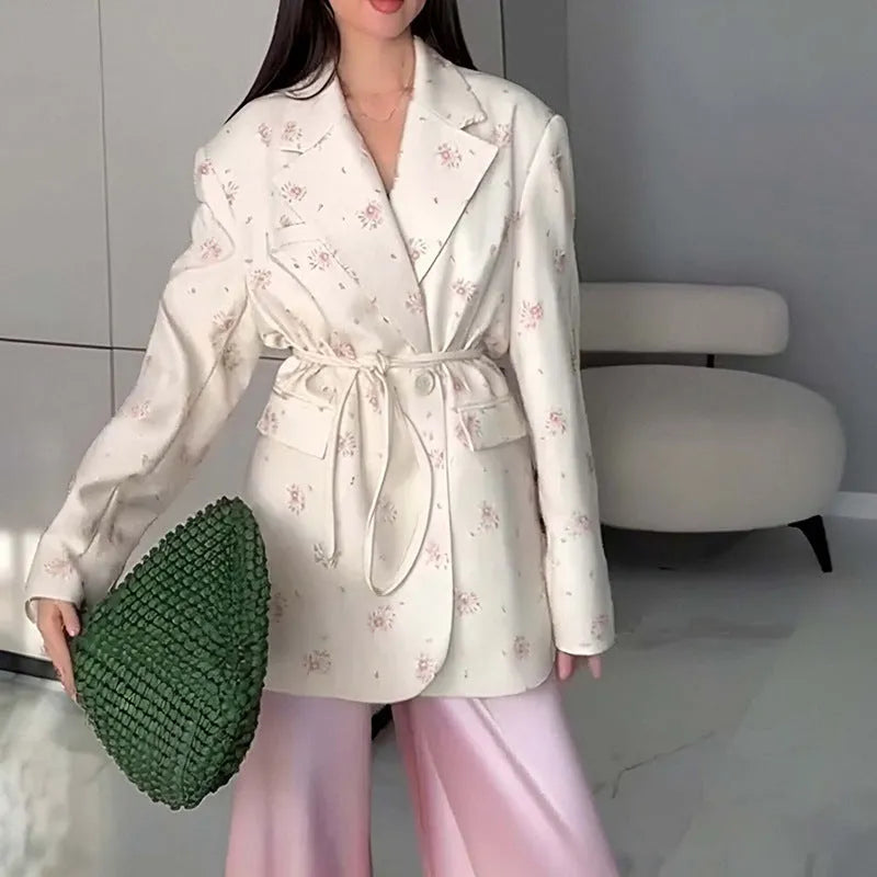 Printed collar suit jacket with lace-up front detail in apricot, shown on a hanger.