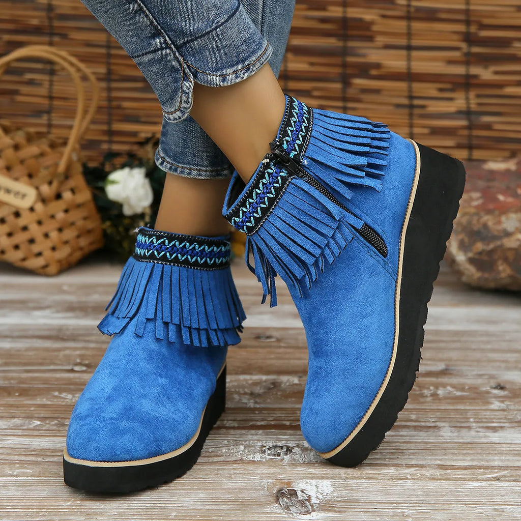 Women's dark brown suede wedge ankle boot with side zipper, tassel, and thick waterproof platform sole.