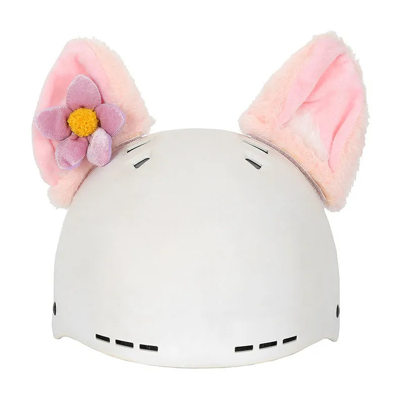 Plush cartoon-themed cover set on a medium motorcycle helmet with soft ear decorations.