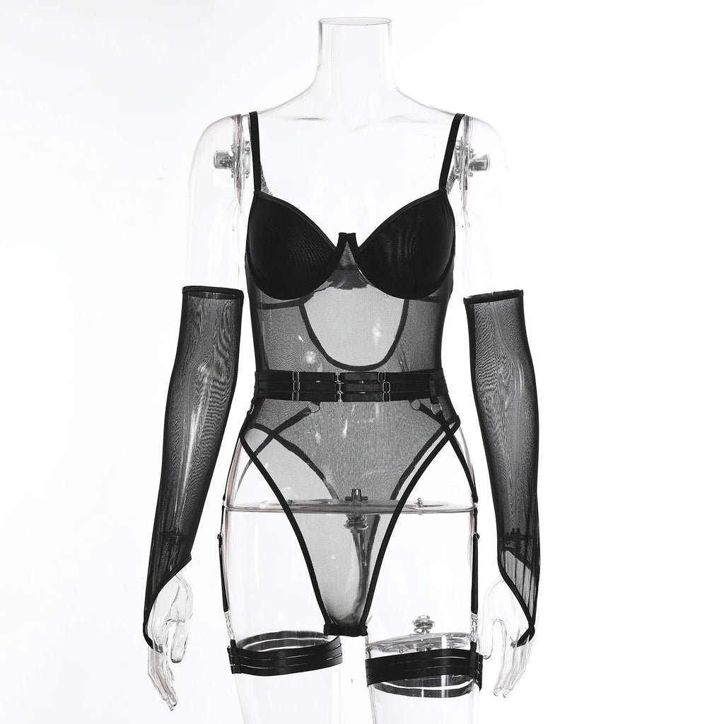 A woman wearing a black see-through mesh jumpsuit with long sleeves and a front zip.