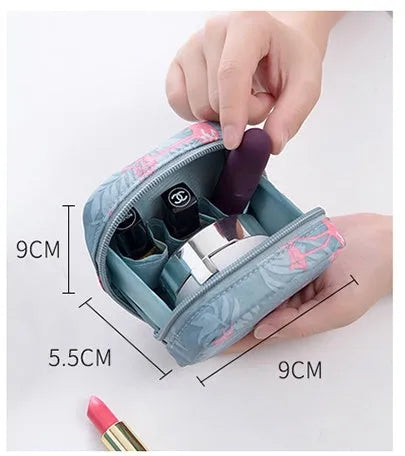 A cube-shaped cloth makeup storage bag in a selection of colours including blue, pink, white, and white pink.
