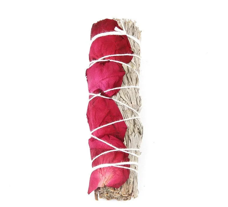 White sage and red rose petal colourful aromatherapy incense bundle on a wooden table