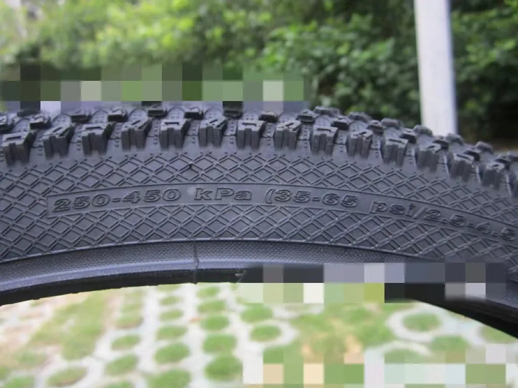 Ultralight puncture-proof mountain bike tyre showing tread and available size options: 26, 27.5, 29 inch.