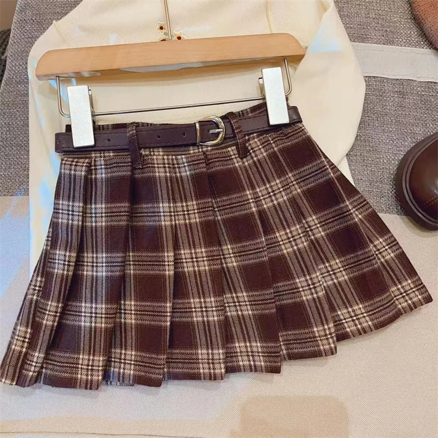 Girls plaid pleated A-line skirt in cotton blend fabric on a hanger