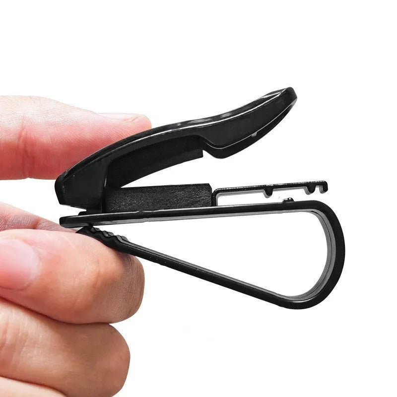 Black plastic clip for mounting glasses and cards on a car sun visor