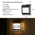 Solar-powered outdoor doorplate light with digital display showing house numbers