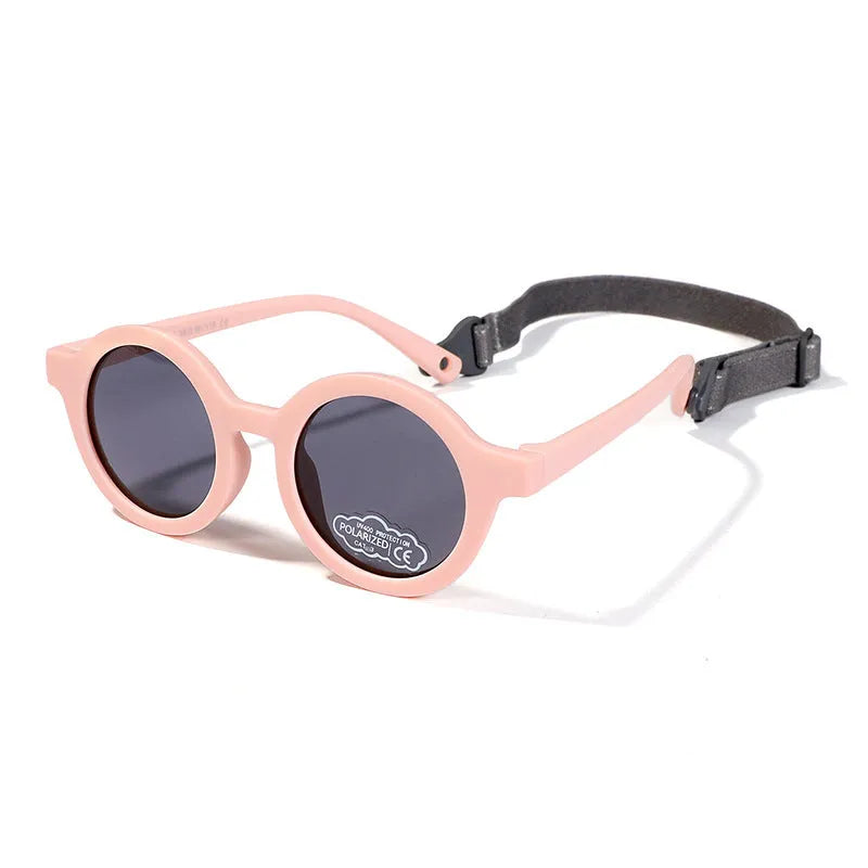 Children's silicone sunglasses with round full frame, UV400 polarised TAC lenses, and flexible TPEE construction for 0-3 year olds
