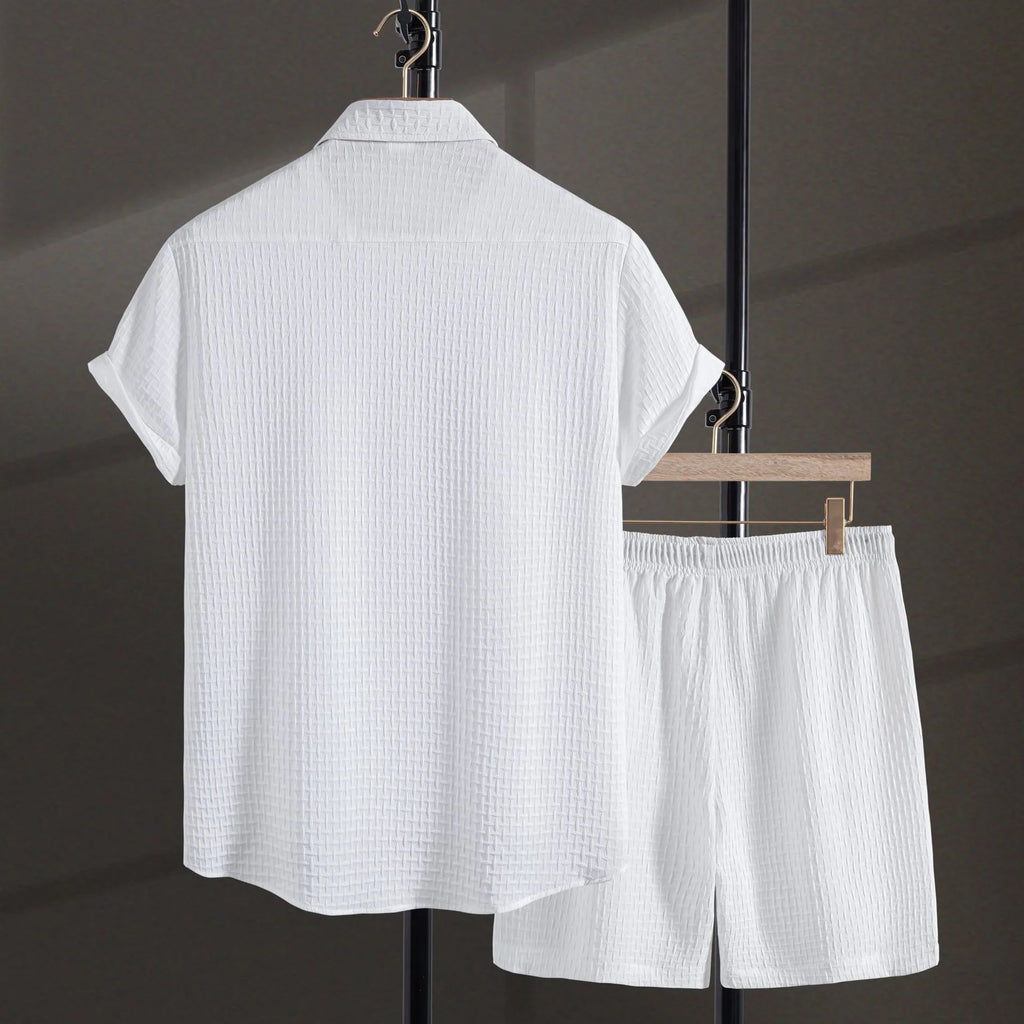 Men's white cotton blend short-sleeve shirt and shorts casual beach suit set laid flat.