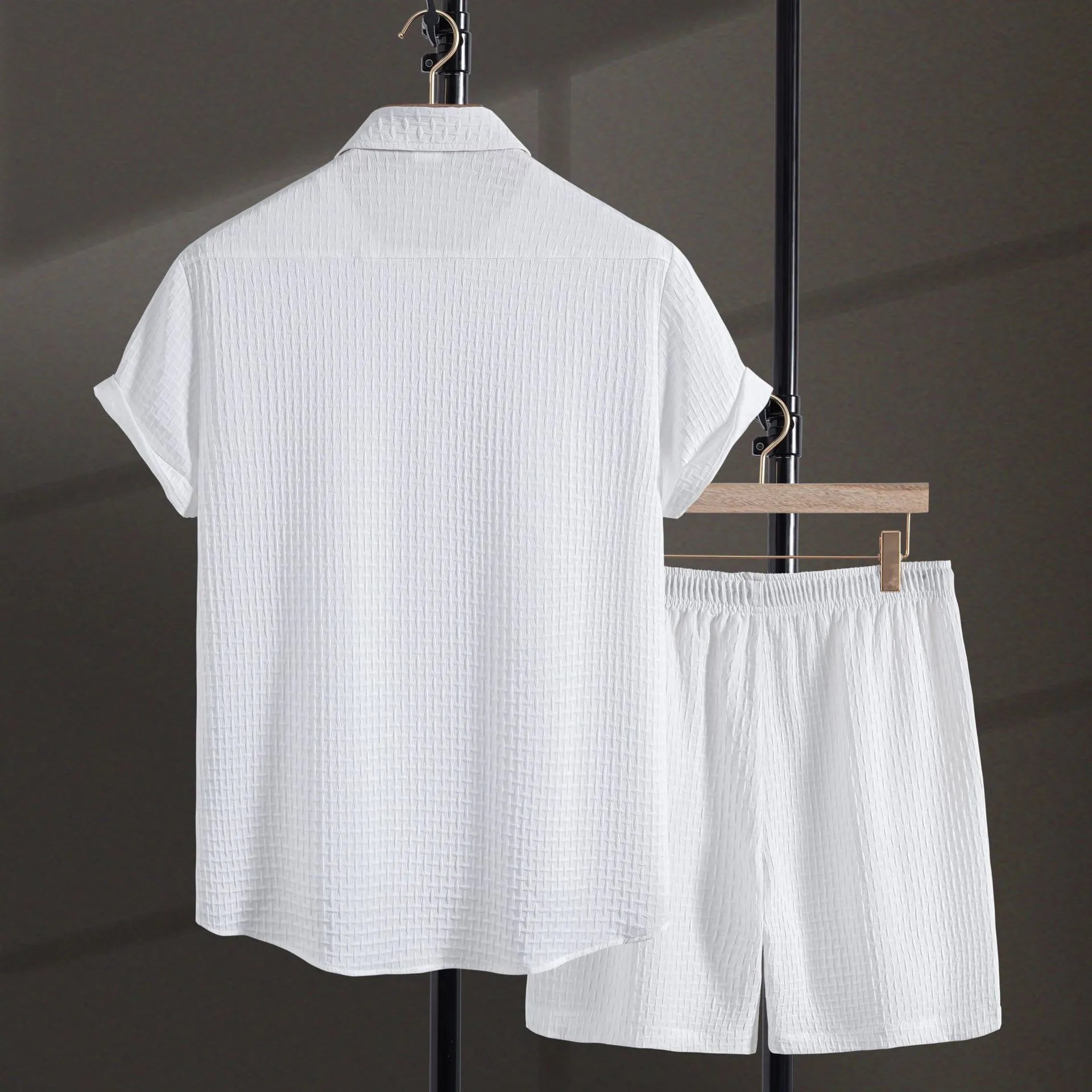 Men's white cotton blend short-sleeve shirt and shorts casual beach suit set laid flat.