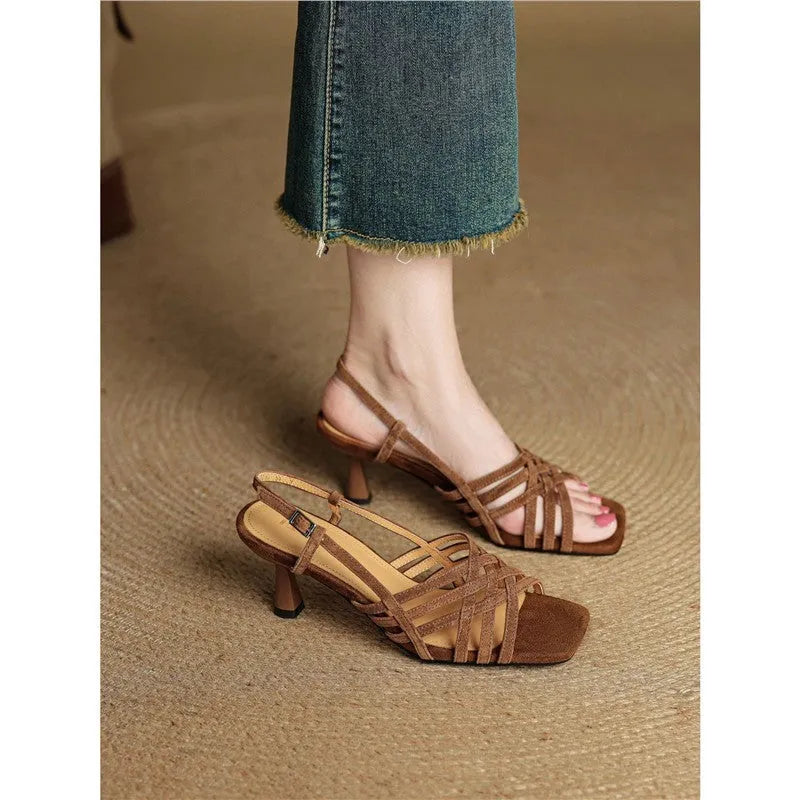 Retro light brown women's high heel sandals with thin cross straps and a square toe on an ankle buckle.