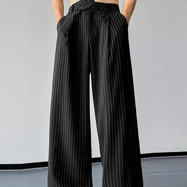 Men's black vertical striped pleated casual trousers showing elasticated waist and leg detail