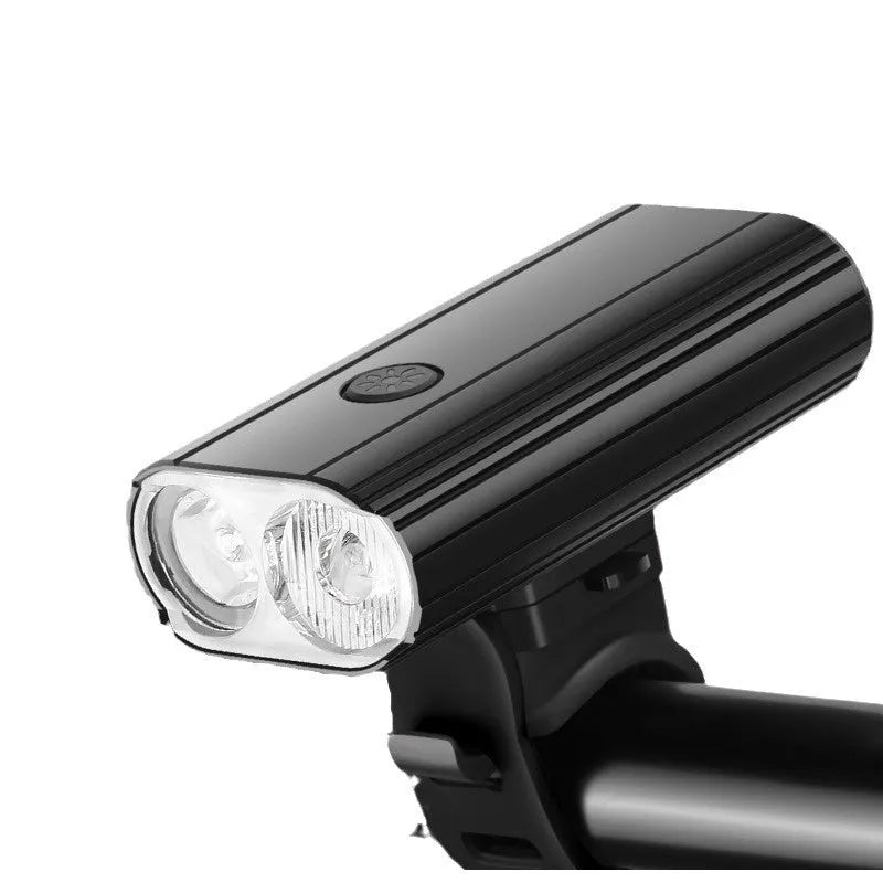 Aluminium alloy bicycle headlight with dual L2 lamps, USB Type-C charging port, and quick-release mounting base.
