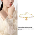 Women's silver bracelet with cherry blossom pendant and Hetian jade beads