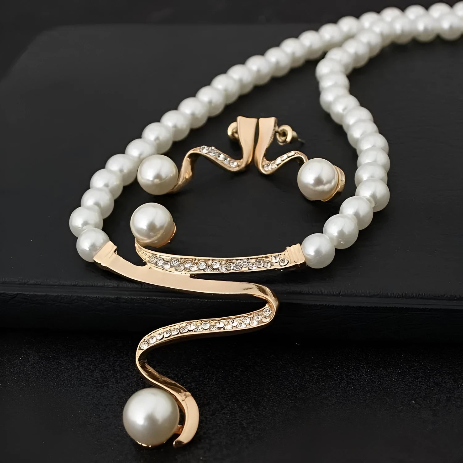 Gold electroplated pearl style necklace and earrings set with deep V clavicle design and drop pendant