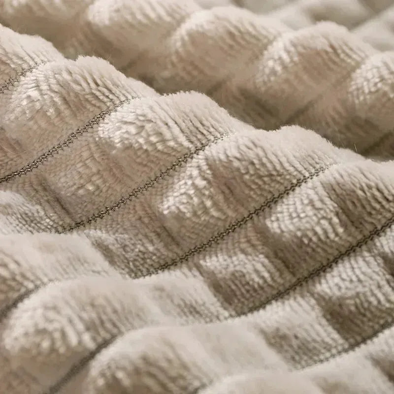 Detachable soft fleece dog bed in green, shown with blanket separated from the cushion base.