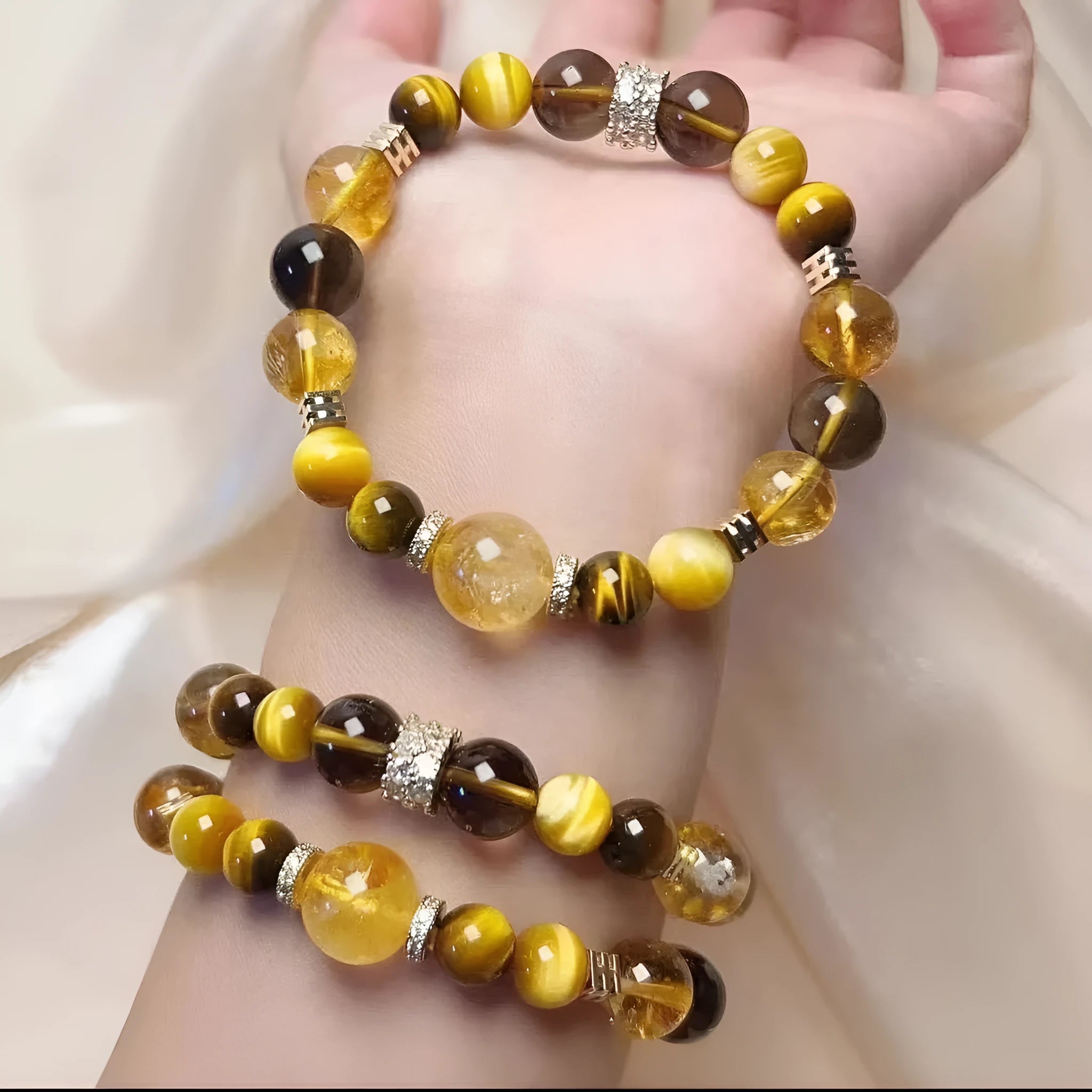 Close-up of a women's natural yellow bracelet with 10mm round artificial crystal beads on a string.