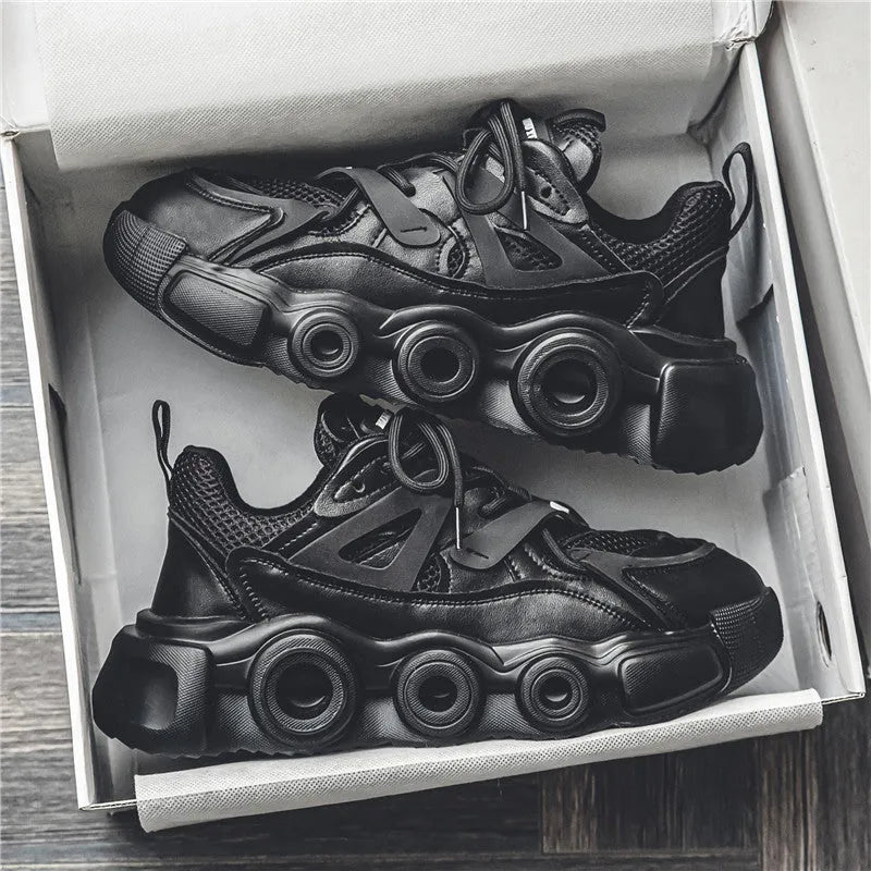 Men's low-top casual sneaker in black with mesh upper, thick rubber sole, and lace-up front.