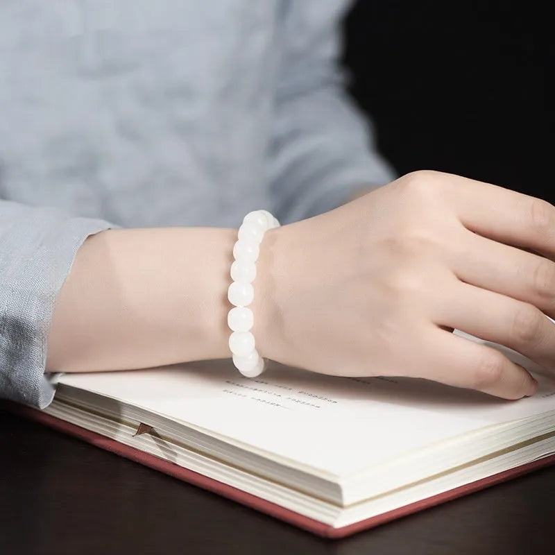 White jade barrel bead bracelet showing Hetian jade construction with traditional barrel beads