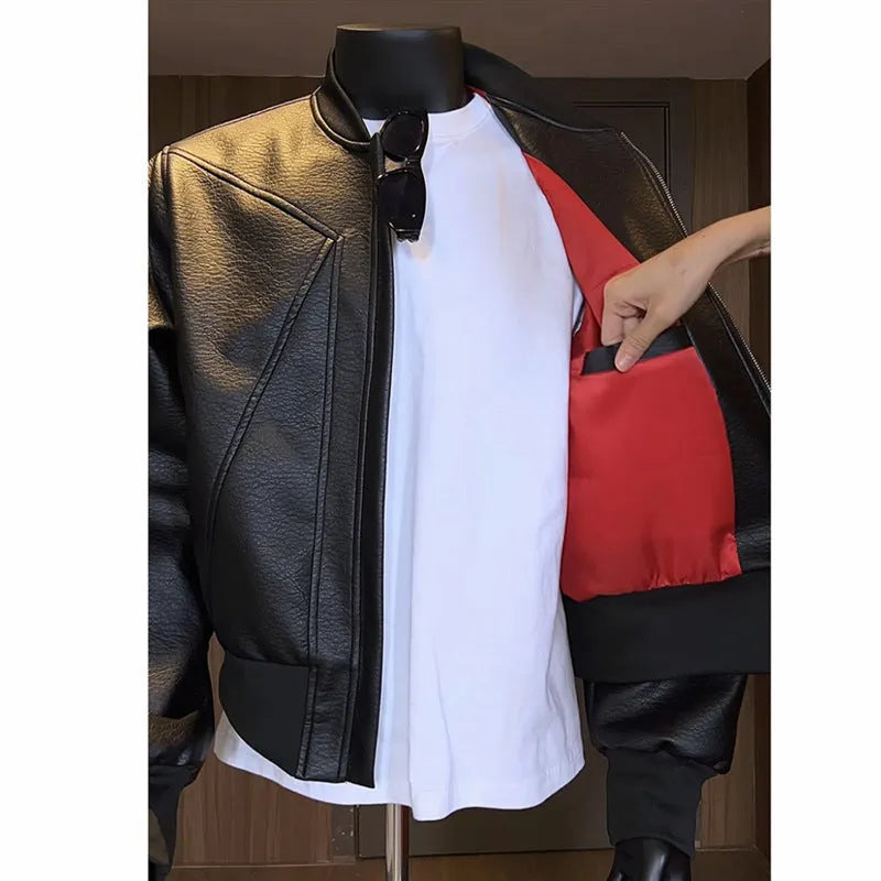 Men's black PU leather business jacket with extended length and slim-fit tailoring on hanger