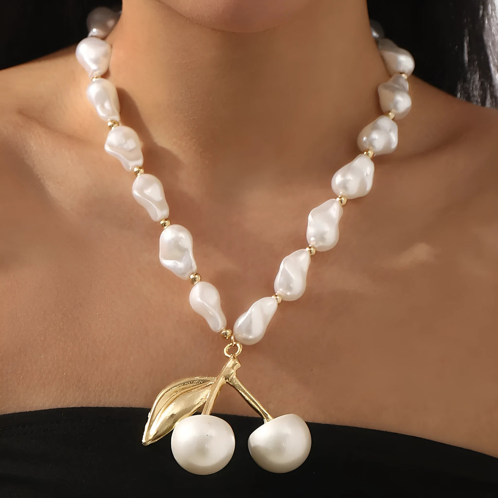 Women's adjustable fruit pendant necklace with pearl chain in gold or white colour.