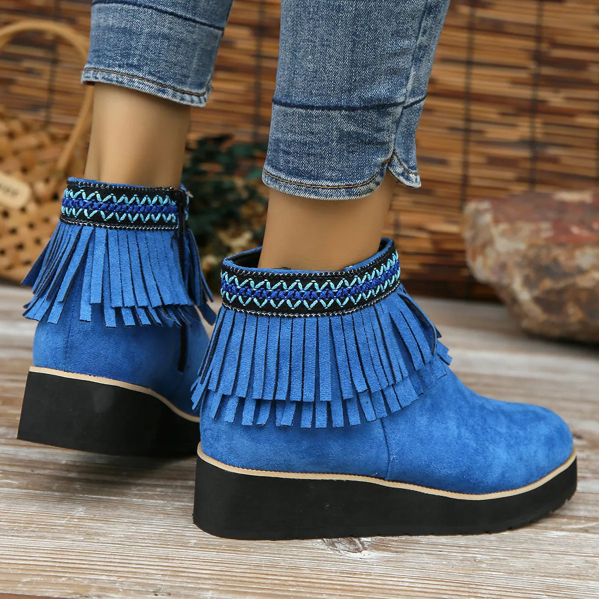 Women's dark brown suede wedge ankle boot with side zipper, tassel, and thick waterproof platform sole.