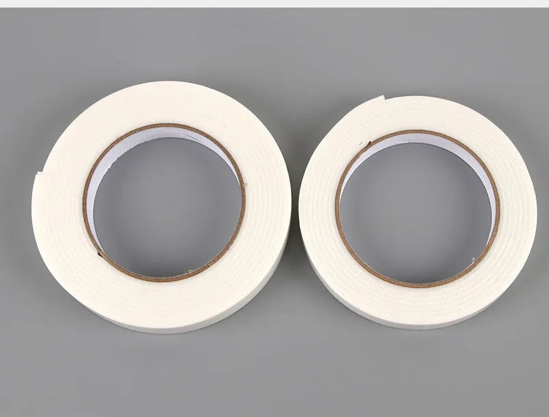 Roll of white foam double-sided adhesive tape showing its thickness, with size options 15mm, 18mm, and 30mm wide.