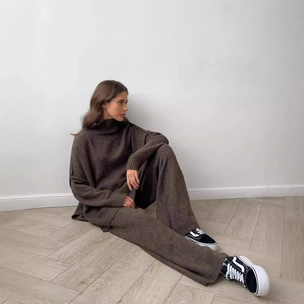 Women's knitted two-piece suit with side-slit sleeve jumper and trousers in dark grey.