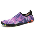 Blue Lycra beach wading shoes for men and women on a sandy shore.