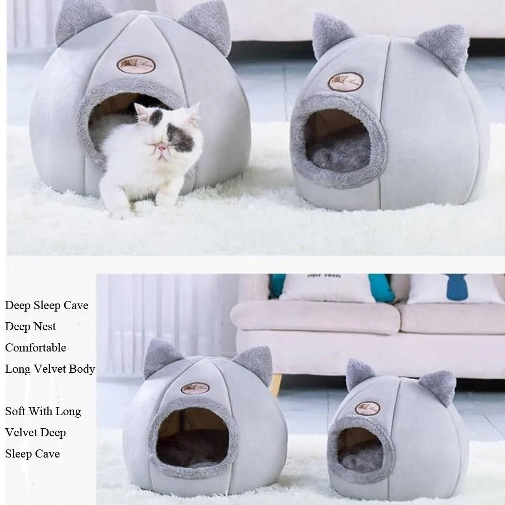 A fully enclosed cube-shaped cat sofa nest, showing the entrance hole, in a home setting.