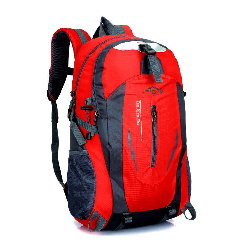 Large red Oxford cloth travel backpack with double straps, showing front zipper and square vertical shape.
