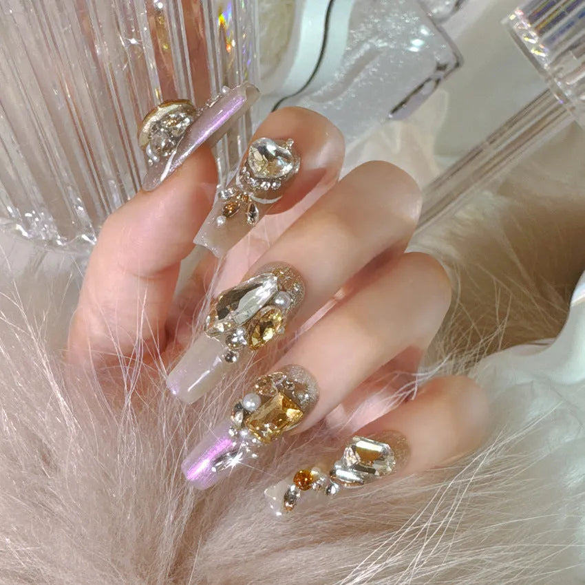 Rhinestone embellished false nail patches in heavy industry luxury designs with card packaging