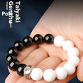 Black and white obsidian Tai Chi mantra bracelet with geometric woven beads
